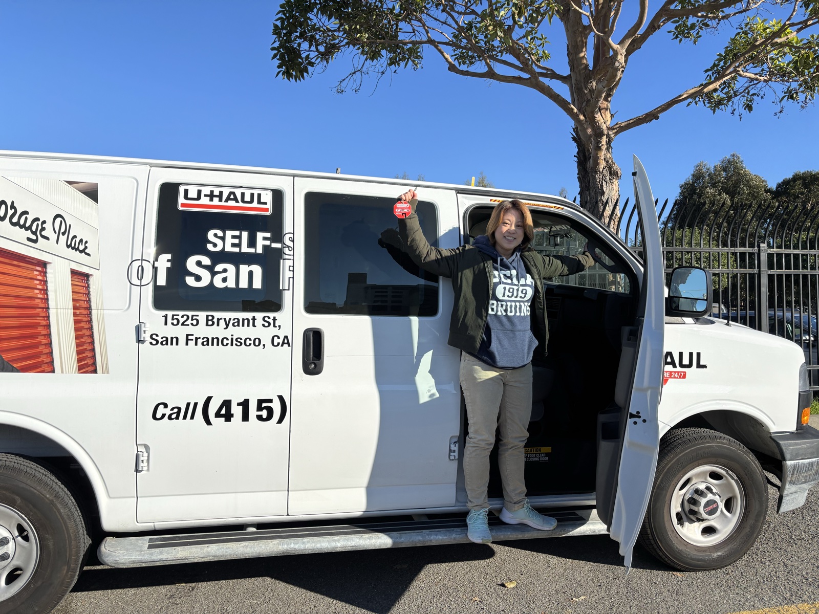 Jenny celebrating outside the U-Haul on load-in day